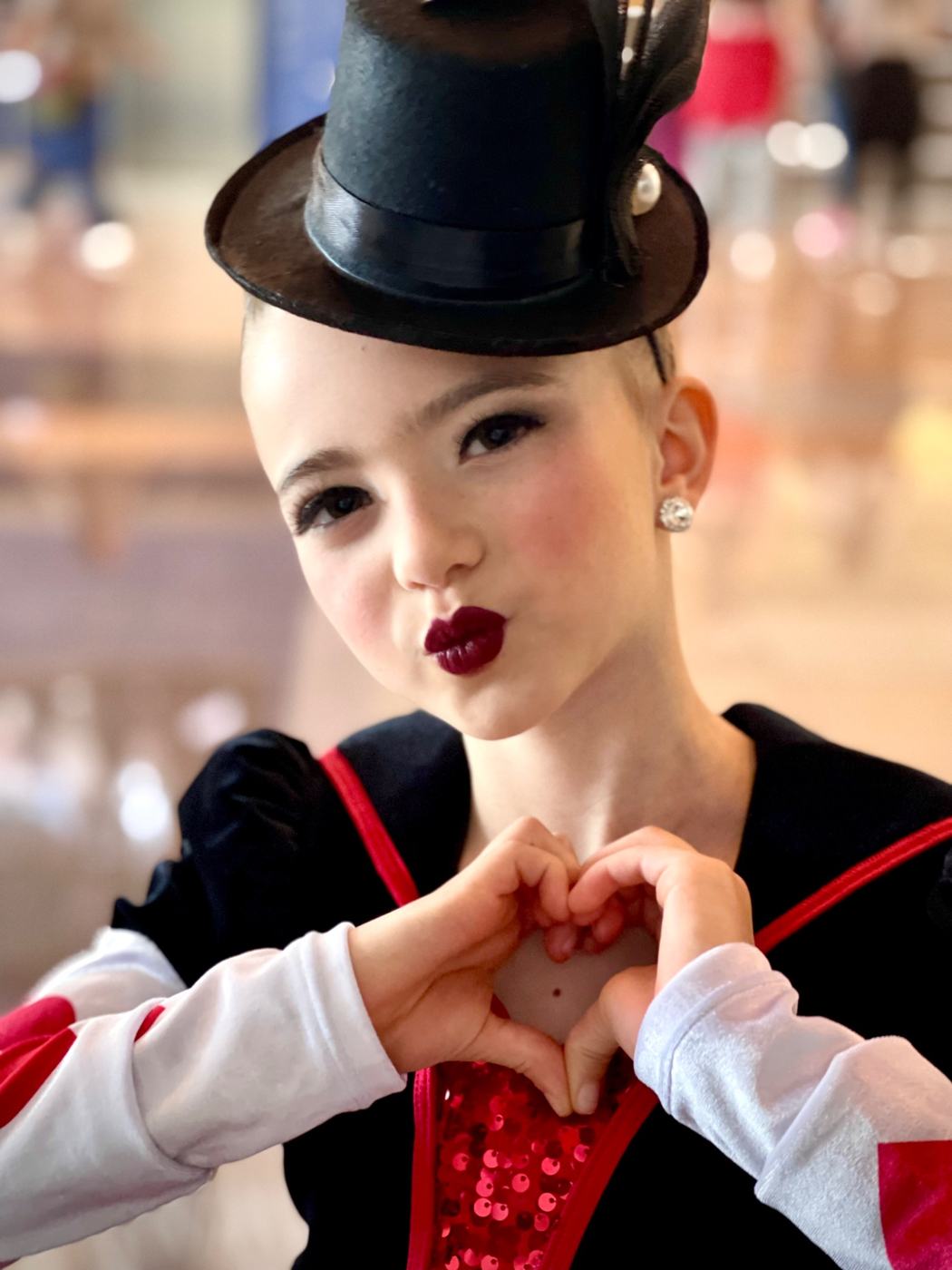 Èlodie smiling in a theatrical dance costume