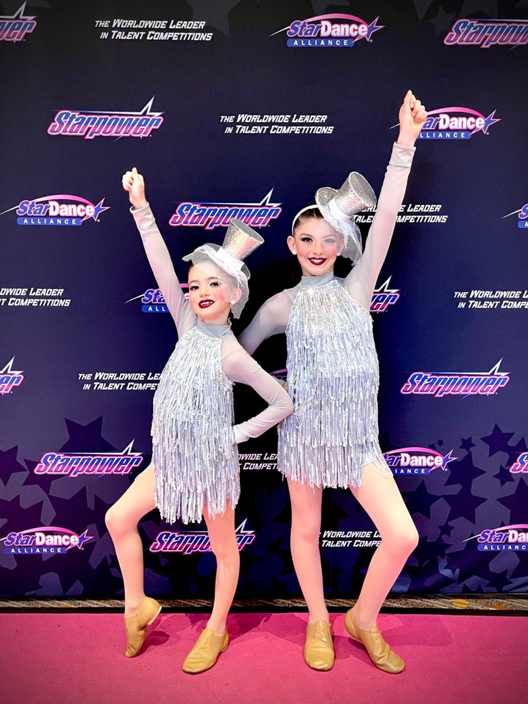 Lyla and Èlodie in matching silver dance costumes