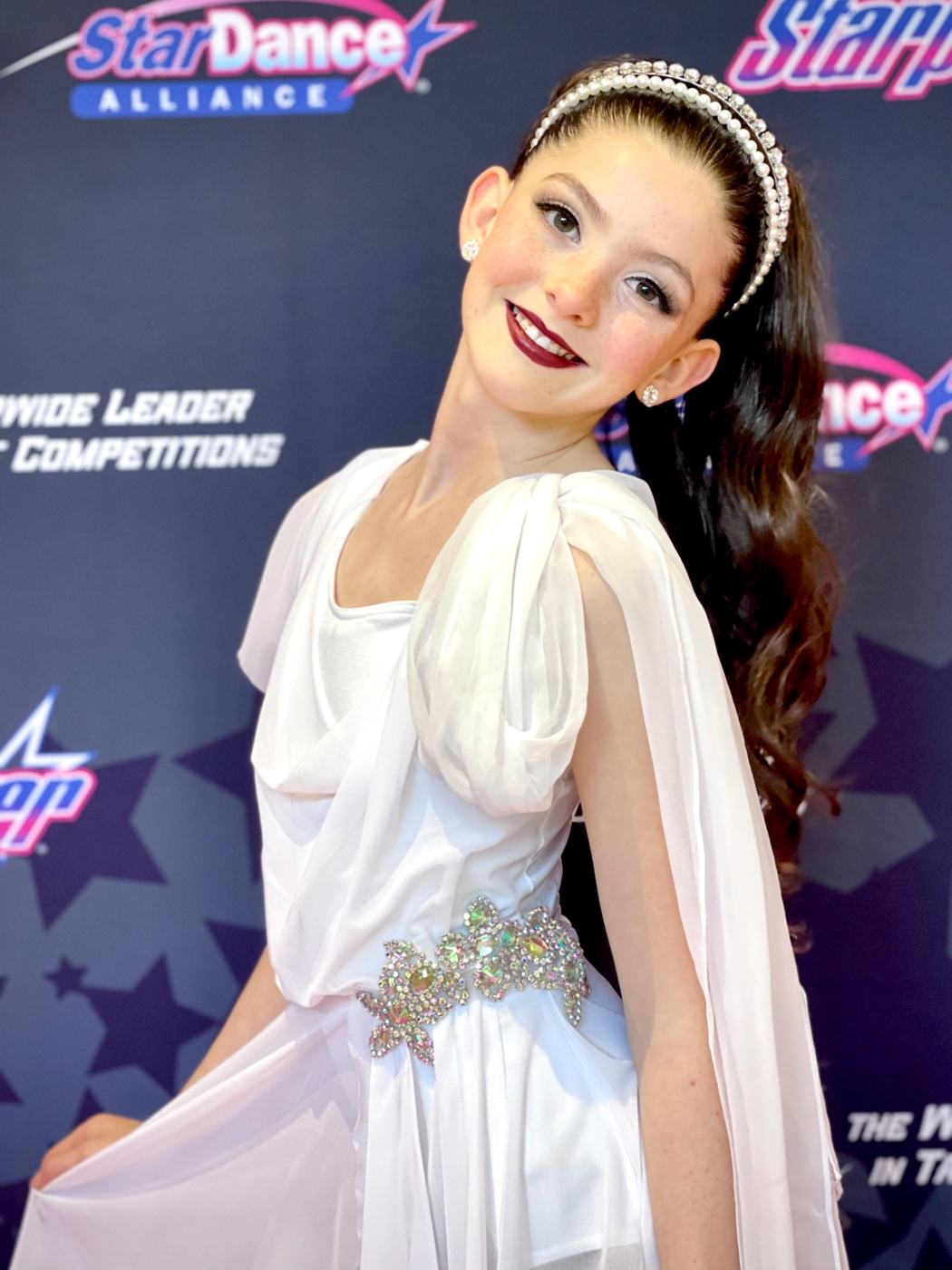Lyla in a white dance costume